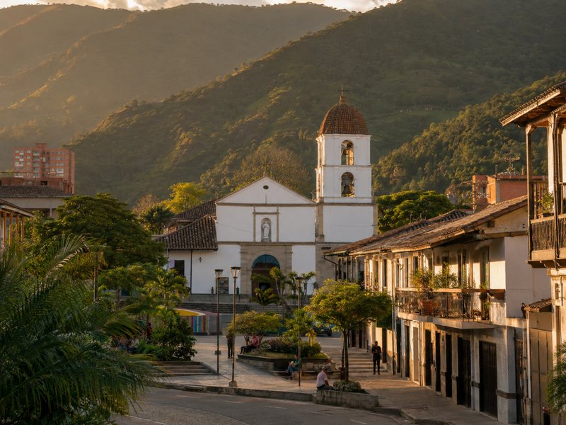 Envigado plaza with church and mountains behind